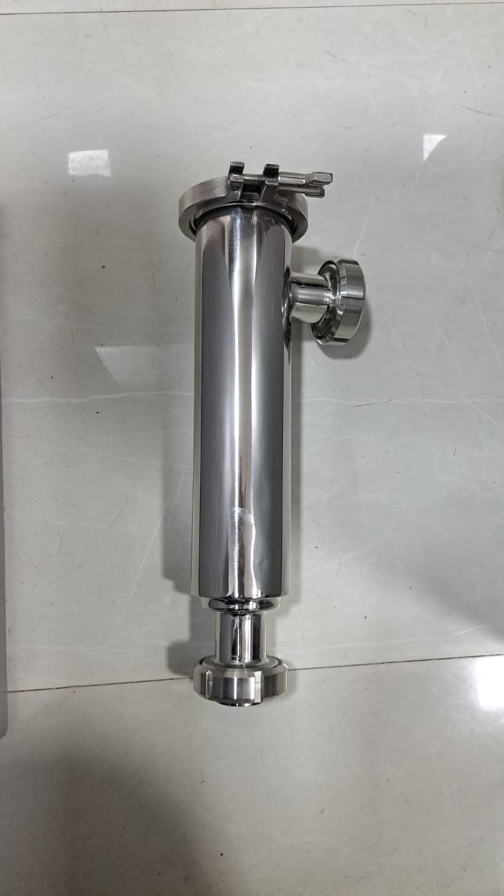 Vertical polished stainless steel inline filter housing with a top TC clamp, side outlet and union end.