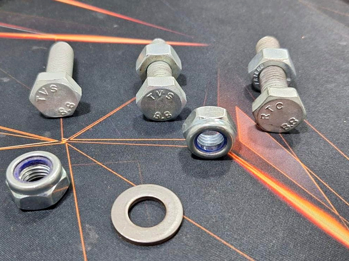 Bolts, nuts and washer with visible blue nylon locking insert