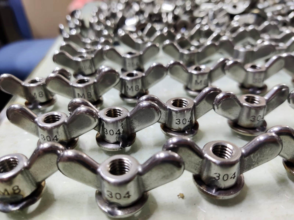 Stainless steel wing nuts with threaded centers