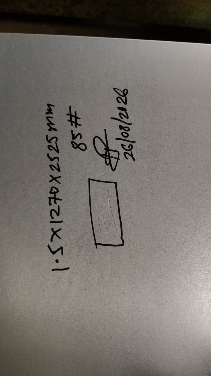 Handwritten material identification tag recording sheet size, gauge and date for traceability